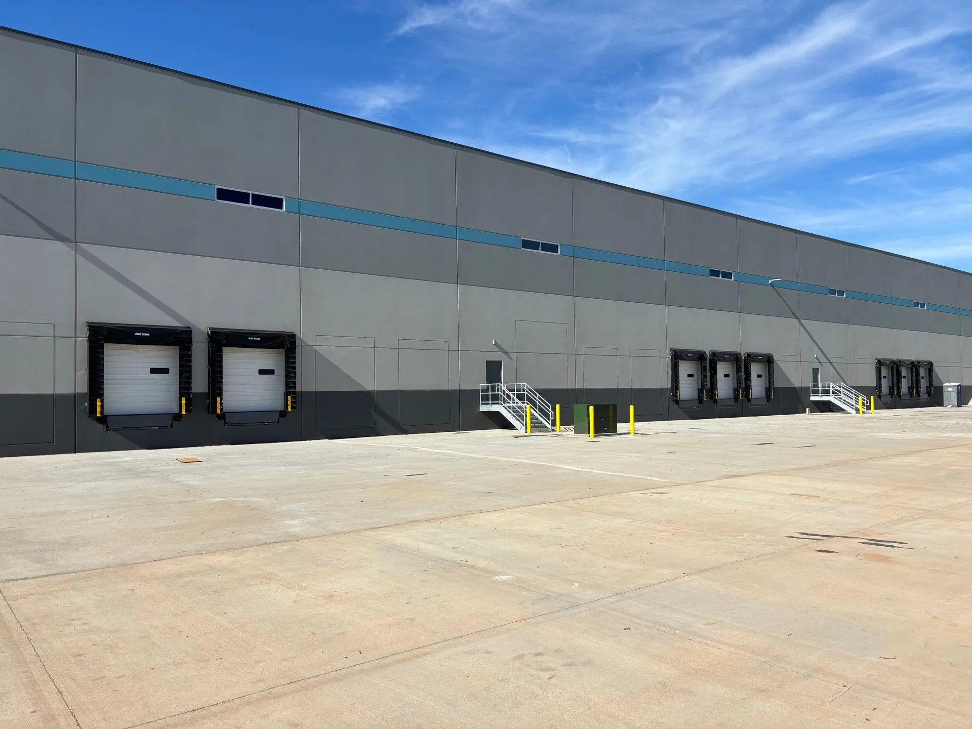 Industrial dock installation with commercial garage doors